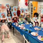 Colorful chaos of creativity as children explore various painting techniques together.